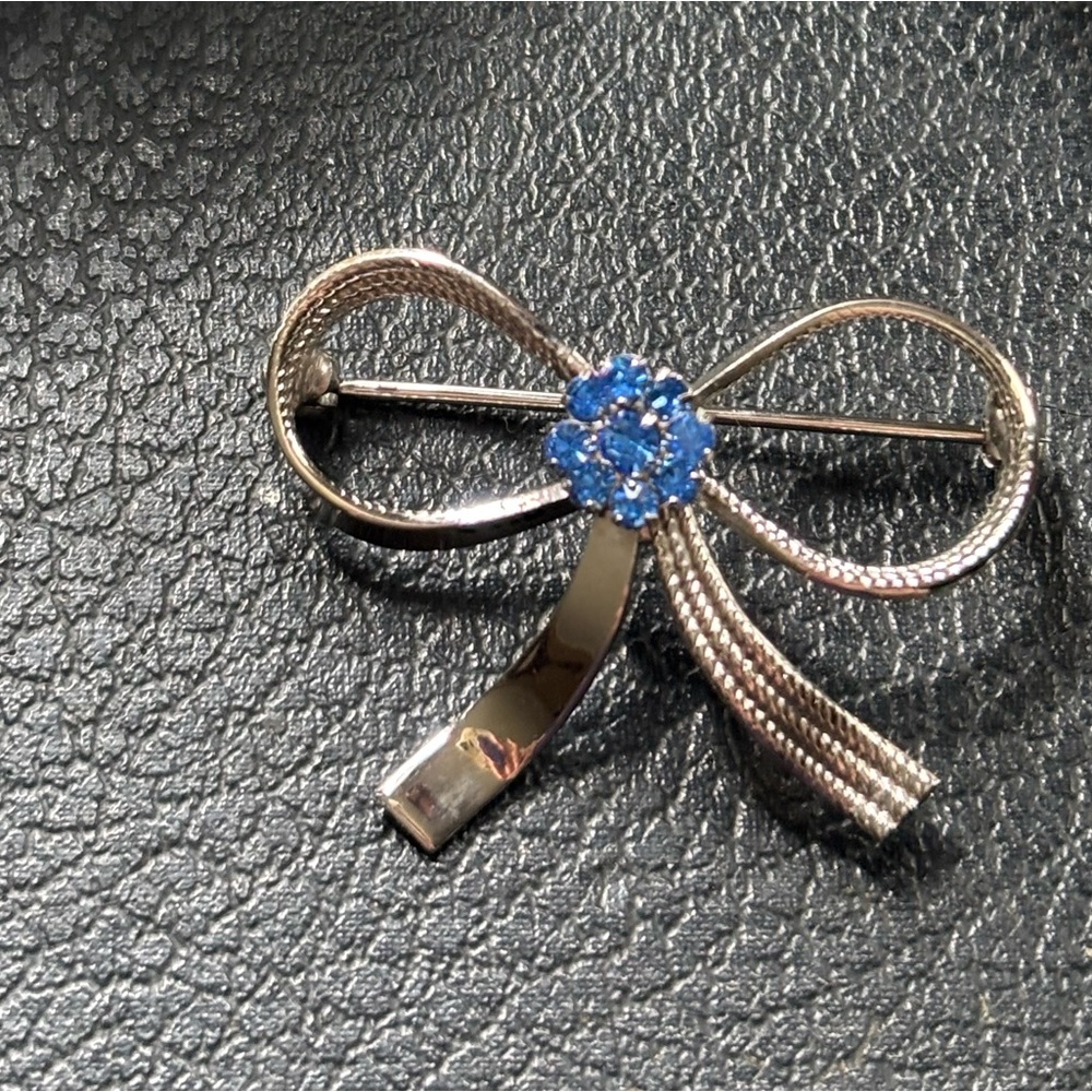 Silver Bow Brooch with Blue Gem